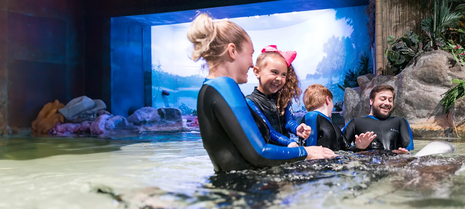 Family in water at Ripley's Aquarium of the Smokies